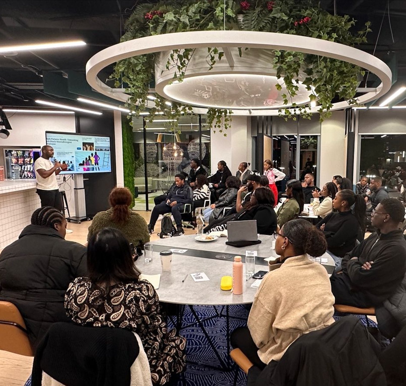 Ashley Alleyne presenting to a full room